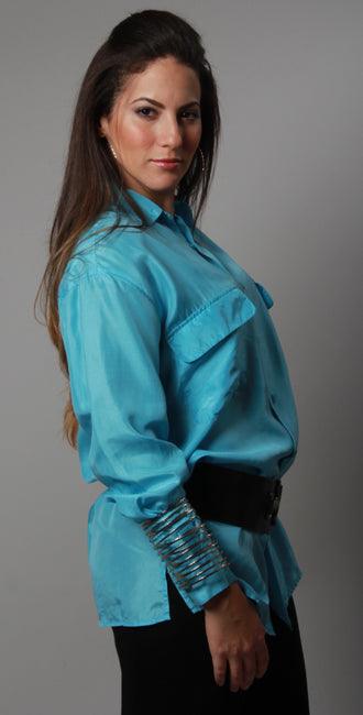 This 100% pure silk aqua blouse features loose-fit shirt style, comfort freezing, bright colors and two breast pockets; a perfect integration of sexy and vogue